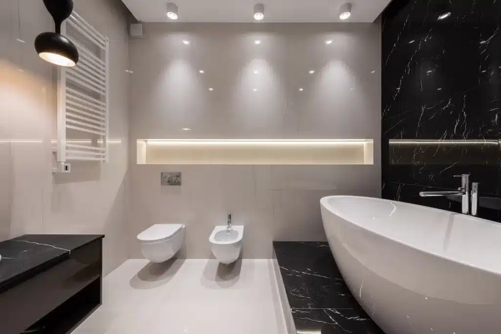A bathroom with enough lights that suits the style.